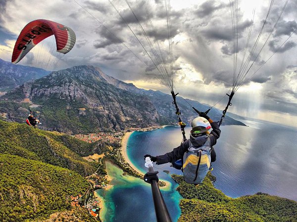     . Another day in paradise. Photo by Burak Tuzer paragliding above ldeniz Fethiye ...
